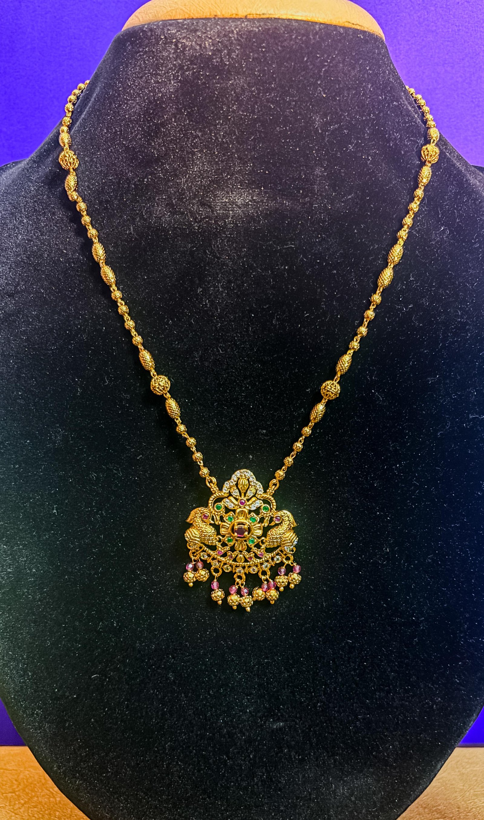 Ornate Gold-Plated Necklace with Colorful Stone Pendant